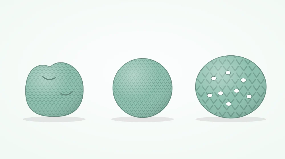 Three crocheted balls in a row: a saggy one with dents, a round evenly filled one, and a stretched one with white showing between the stitches