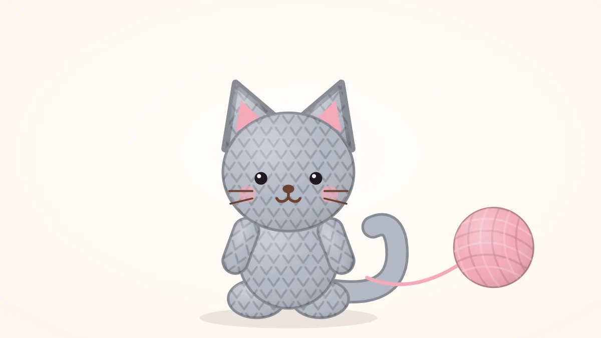 Sitting crocheted cat in soft gray with pointed ears, a long tail curled to one side and embroidered whiskers