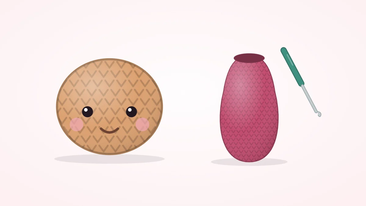 A crocheted head shaped like a large ball with eyes and a separate pear-shaped body lying side by side, not yet joined, with a crochet hook
