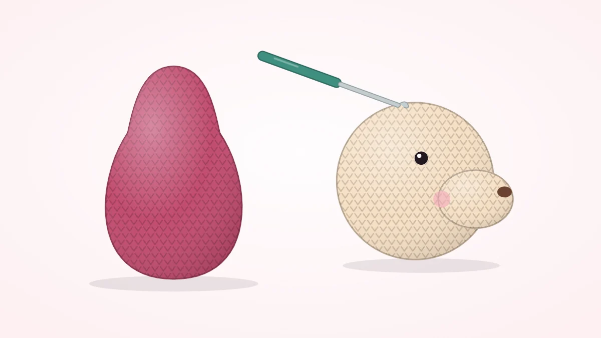 Crocheted pear-shaped body with a rounded tummy beside a crocheted head with a protruding snout and a crochet hook